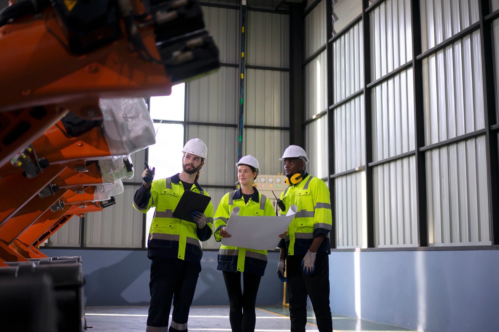 Engineering professional working with advanced manufacturing equipment