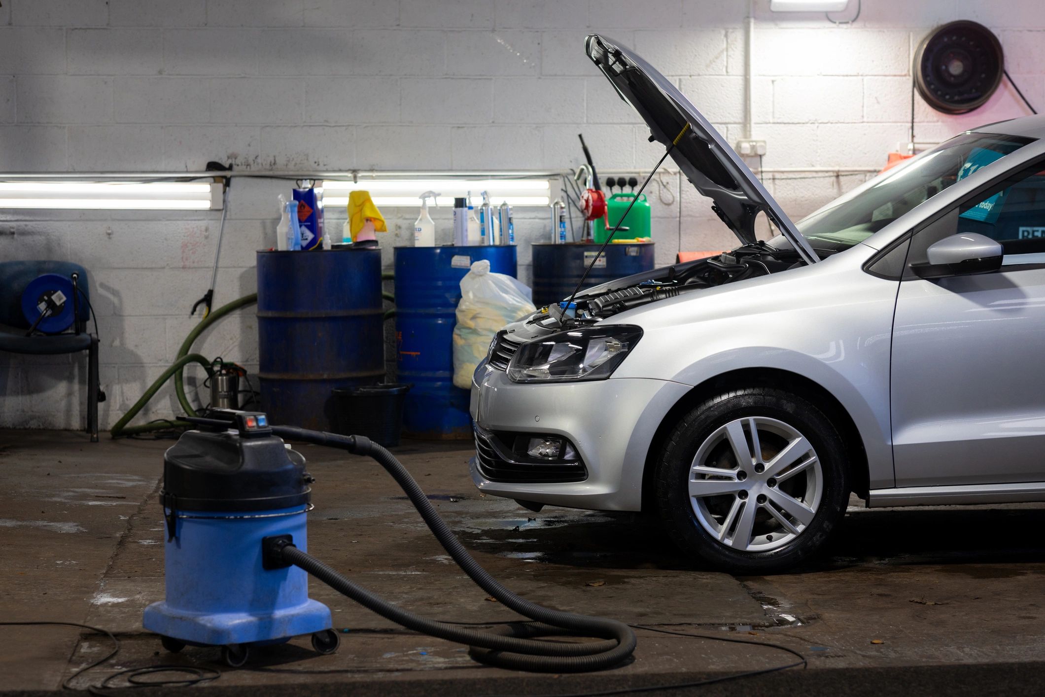 Performance vehicle in service bay during technical evaluation